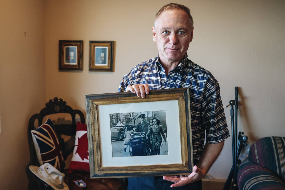 David Gibson holds a photo of his parents Gordon and Marjorie Gibson at his home Thursday, May ...