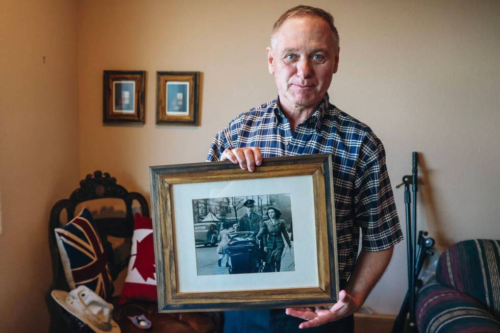 David Gibson holds a photo of his parents Gordon and Marjorie Gibson at his home Thursday, May ...