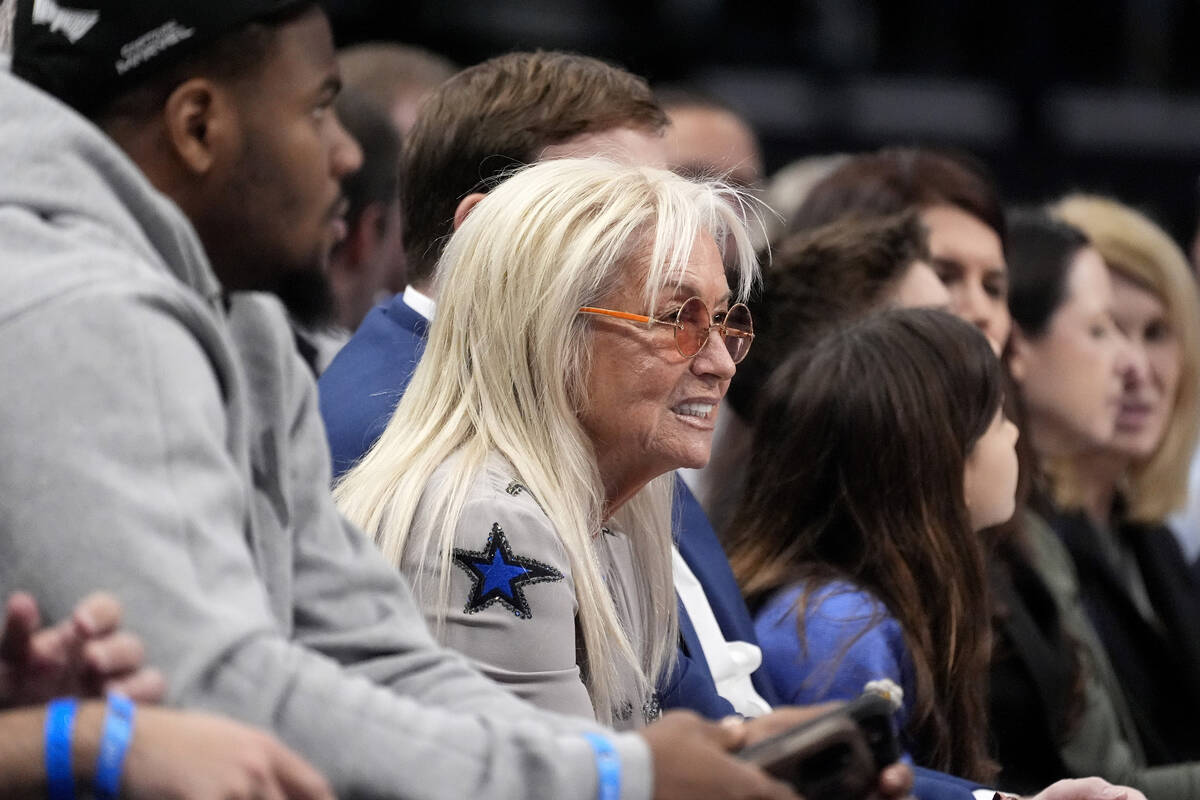 Miriam Adelson, second from left, watches the Phoenix Suns play the Dallas Mavericks in the fir ...