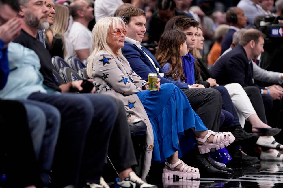 Miriam Adelson, center left, and Dallas Mavericks governor Patrick Dumont, center right, watch ...