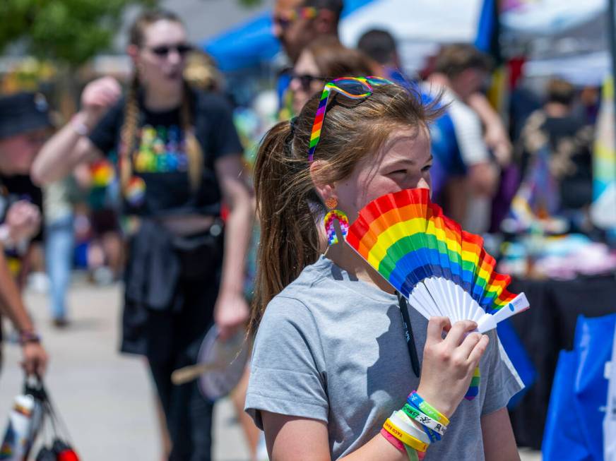 A girl walks about with a rainbow fan during the 4th Annual Henderson Pride Festival about Cit ...