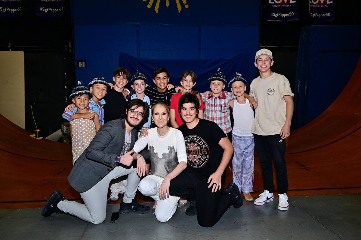 Celine Dion and her family are shown backstage with cast members of "Love" at the Mirage on Fri ...