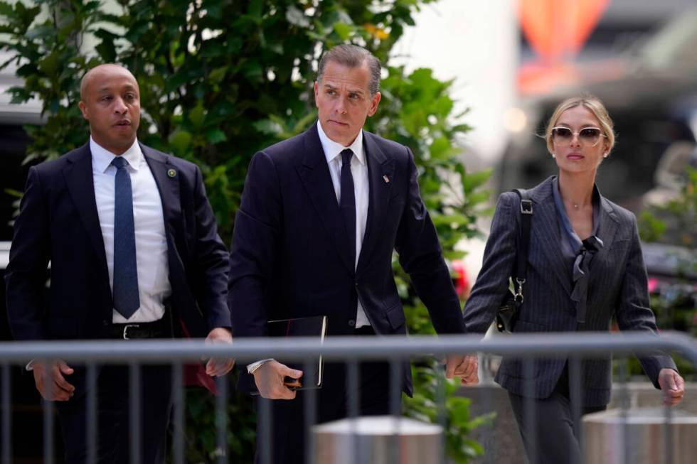 Hunter Biden, center, and his wife, Melissa Cohen Biden, right, arrive at federal court, Monday ...