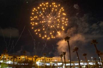 Fireworks go off above the Green Valley Ranch, on Sunday, July 4, 2021, in Henderson. (Bizuayeh ...
