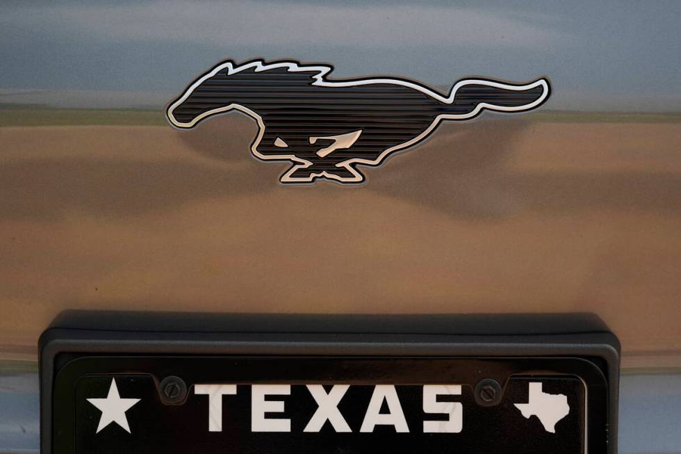 A Ford Mustang Mach-E logo is seen of a vehicle Thursday, May 9, 2024, in San Antonio. Many Ame ...