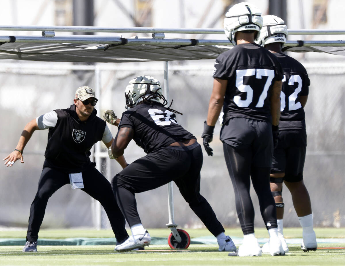 Raiders defensive tackles Adam Butler (69) runs through drills during organized team activities ...