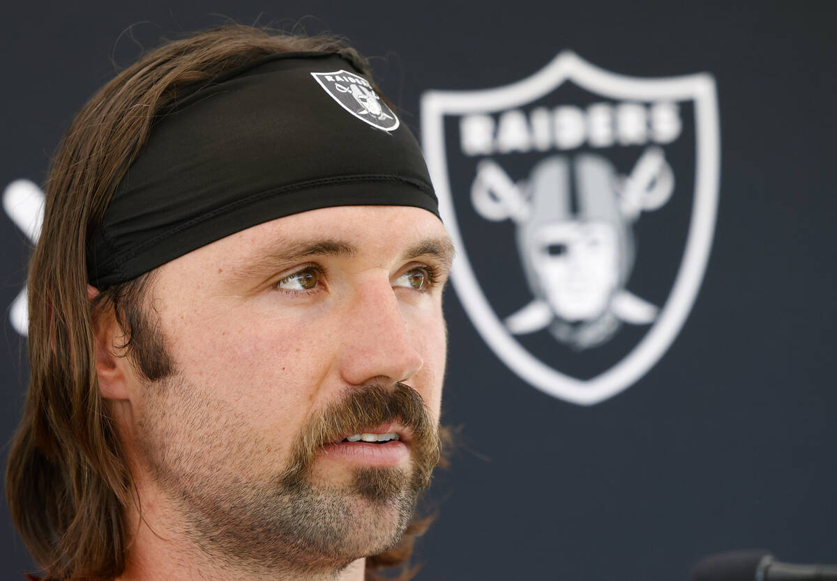 Raiders quarterback Gardner Minshew II listens to reporters questions as he addresses the media ...