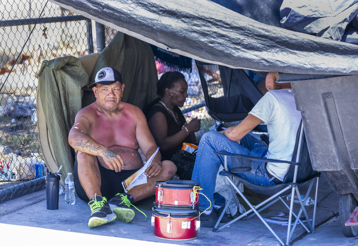 Some homeless escape the heat under a tarp shelter along North A Street as Vegas Stronger's Str ...