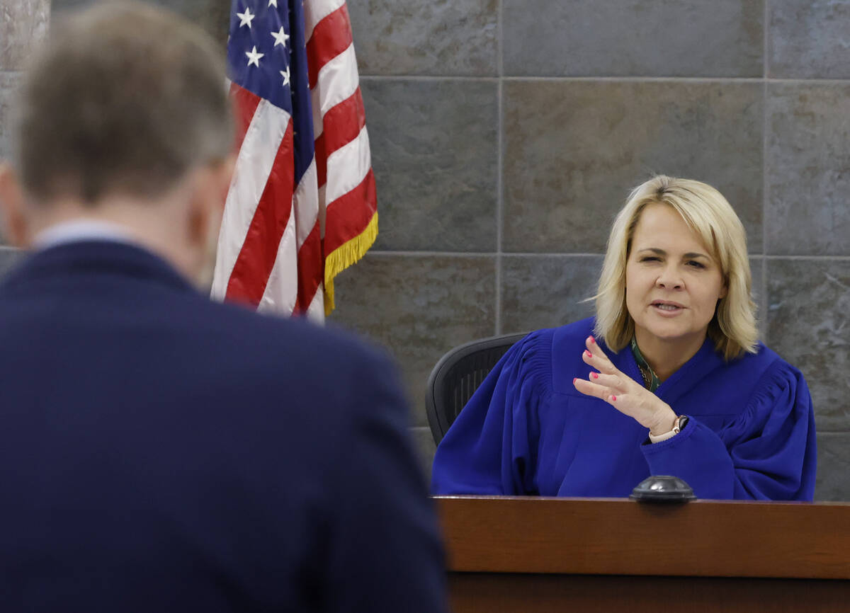 David Westbrook, left, a public defender, listens as Judge Amy JoAnne Chenini presides over Col ...