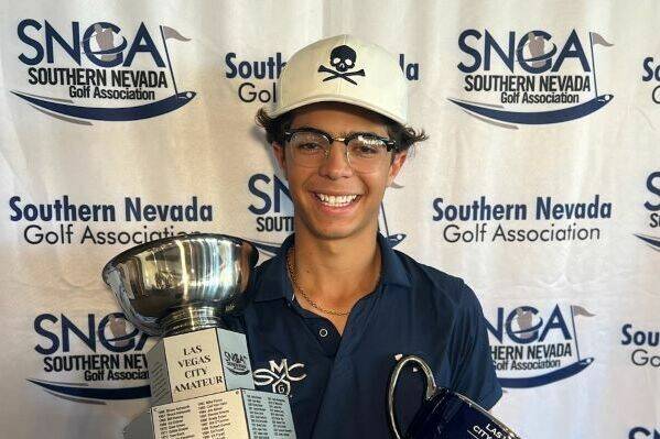 Avery Lazarski holds his trophies after winning the Las Vegas City Amateur for the second conse ...