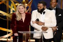 Christina Applegate, left, and host Anthony Anderson speak onstage during the 75th Primetime Em ...