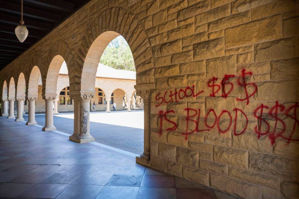 Graffiti is painted on the wall near the office of the President at Stanford University in Palo ...