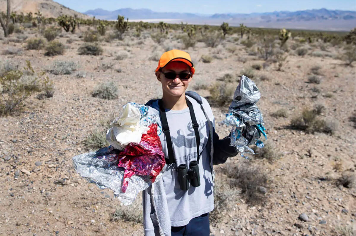 Christian Daniels, 15, displays balloons he found on Saturday, April 17, 2021, in Las Vegas. Ch ...