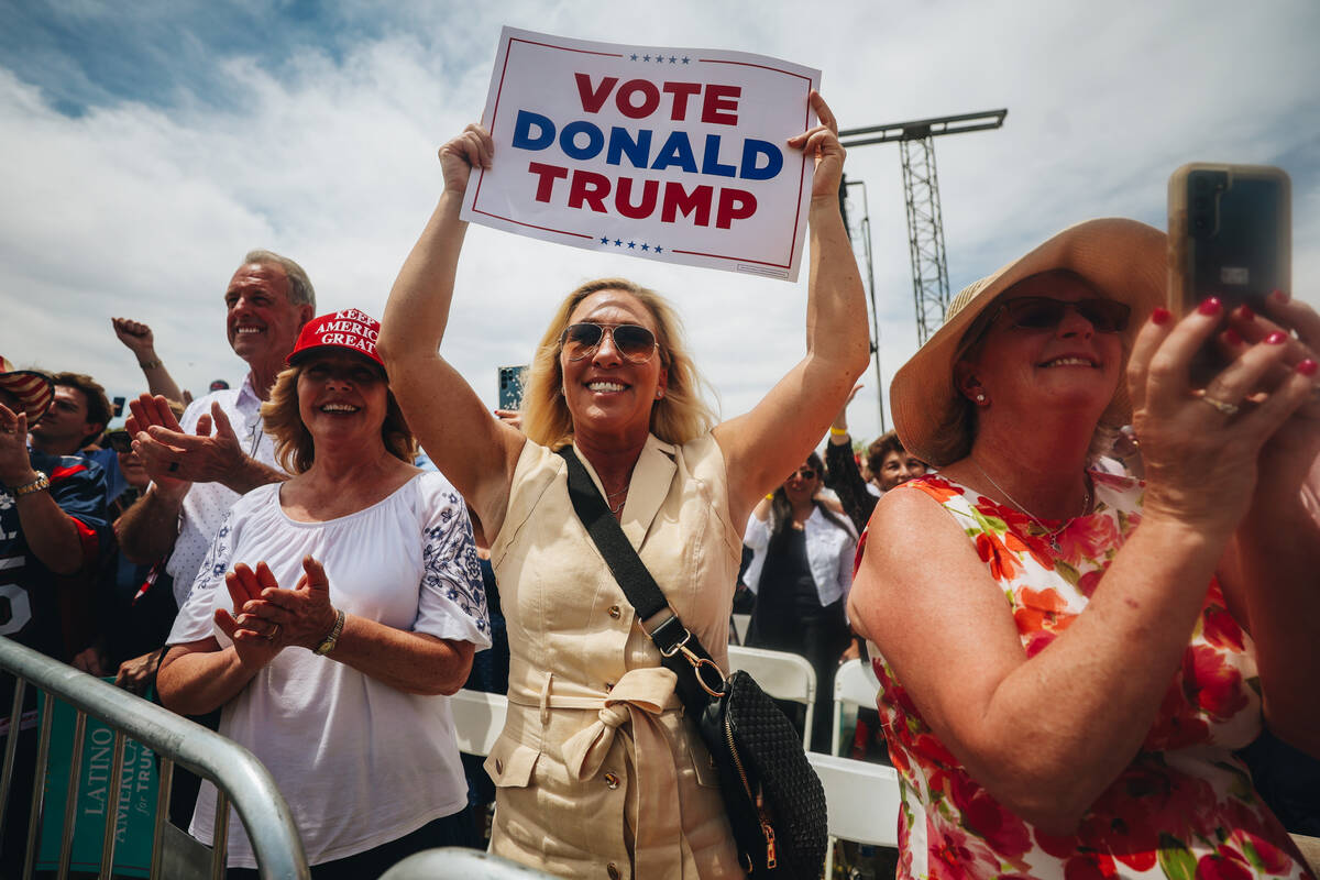 U.S. Rep Marjorie Taylor Greene, R-Ga., cheers as former President Donald Trump speaks at a ral ...