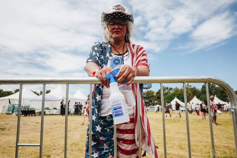 Trump supporters bow their heads in prayer at a rally for the former president at Sunset Park o ...