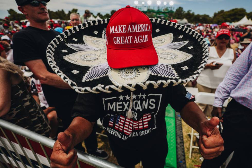 A supporter shows off their makeshift Trump sombrero Former President Donald Trump speaks at a ...