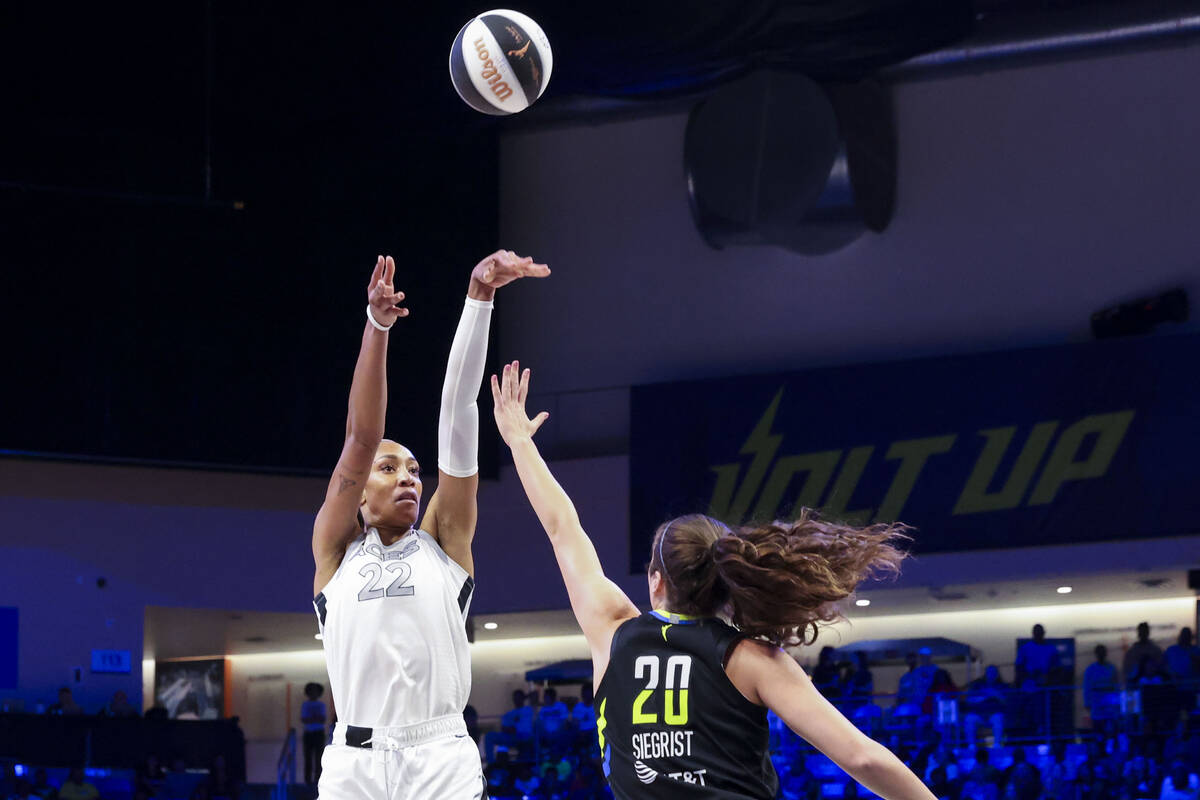 Las Vegas Aces center A'ja Wilson (left) shoots over Dallas Wings forward Maddy Siegrist during ...