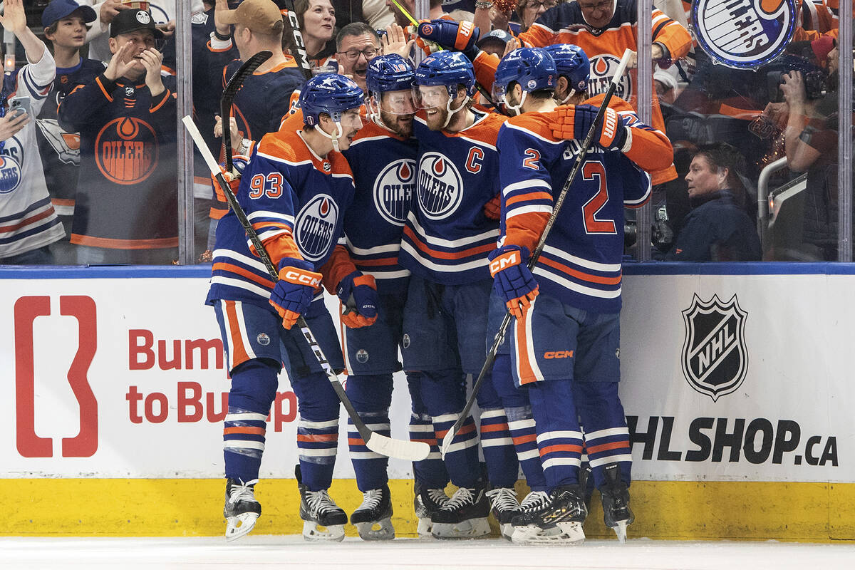 Edmonton Oilers' Ryan Nugent-Hopkins (93), Zach Hyman (18), Connor McDavid (97) and Evan Boucha ...