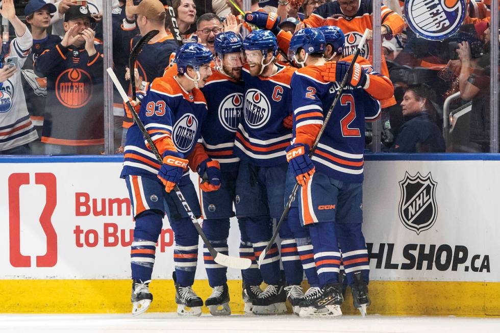 Edmonton Oilers' Ryan Nugent-Hopkins (93), Zach Hyman (18), Connor McDavid (97) and Evan Boucha ...