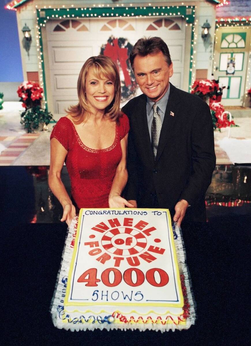 Vanna White, left, and Pat Sajak display "The Wheel of Fortune" cake, in celebration of its 4,0 ...