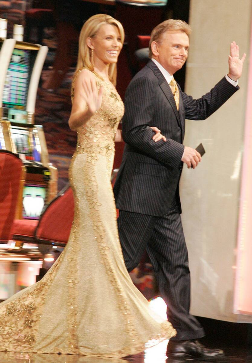Vanna White and Pat Sajak enter the stage during the Wheel of Fortune taping at the Venetian Sa ...