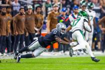 Raiders cornerback Jakorian Bennett (0) dives to tackle New York Jets wide receiver Garrett Wil ...