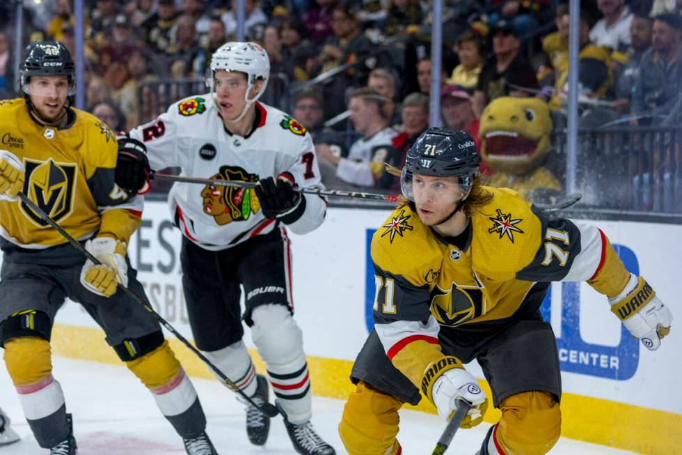 Golden Knights center William Karlsson (71) looks to teammates with Chicago Blackhawks defensem ...