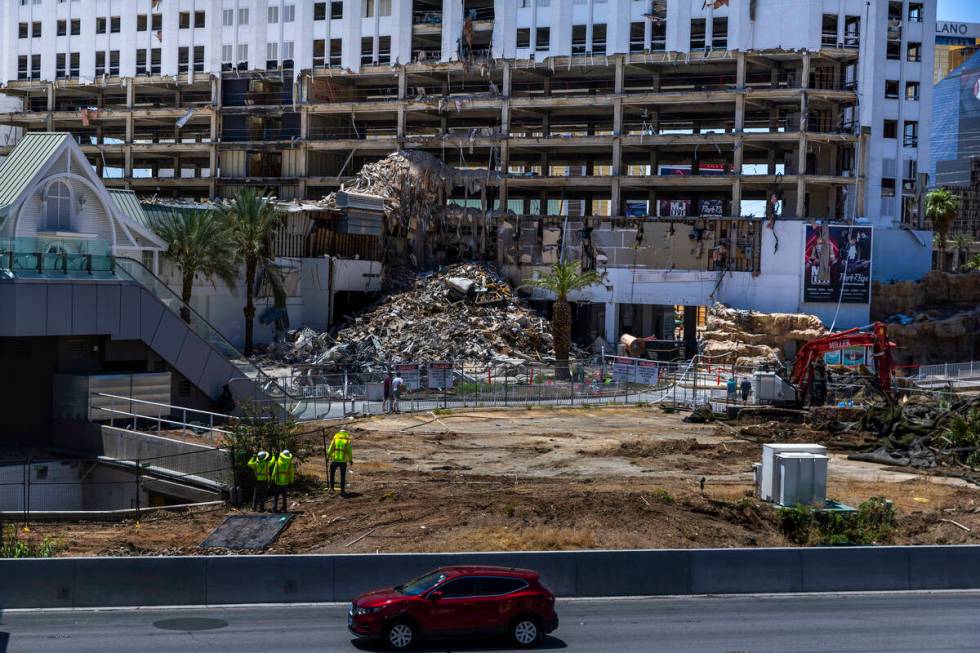 Debris is piled up near the former entrance as lower floors are stripped of all interior elemen ...