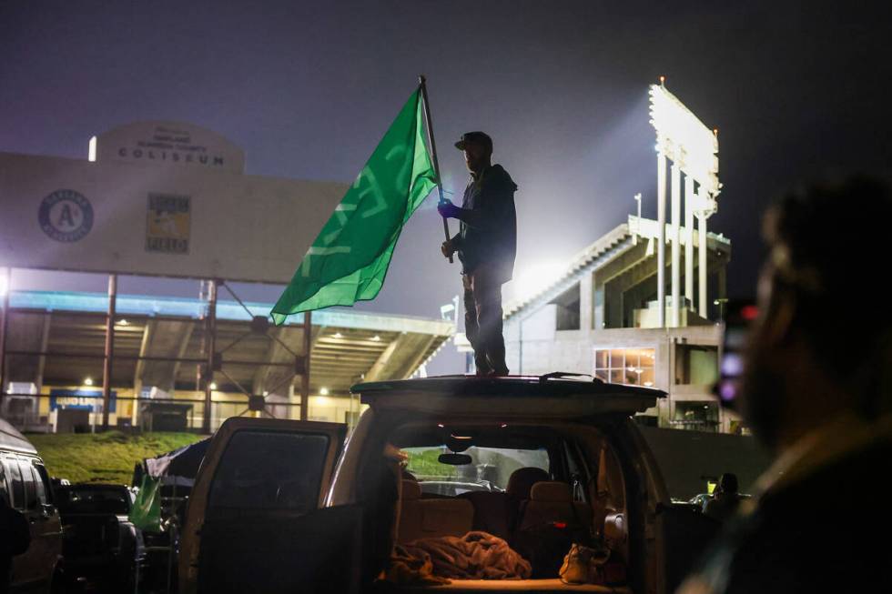 Oakland Athletics fans honk their cars and chant “sell the team” in the fifth inn ...