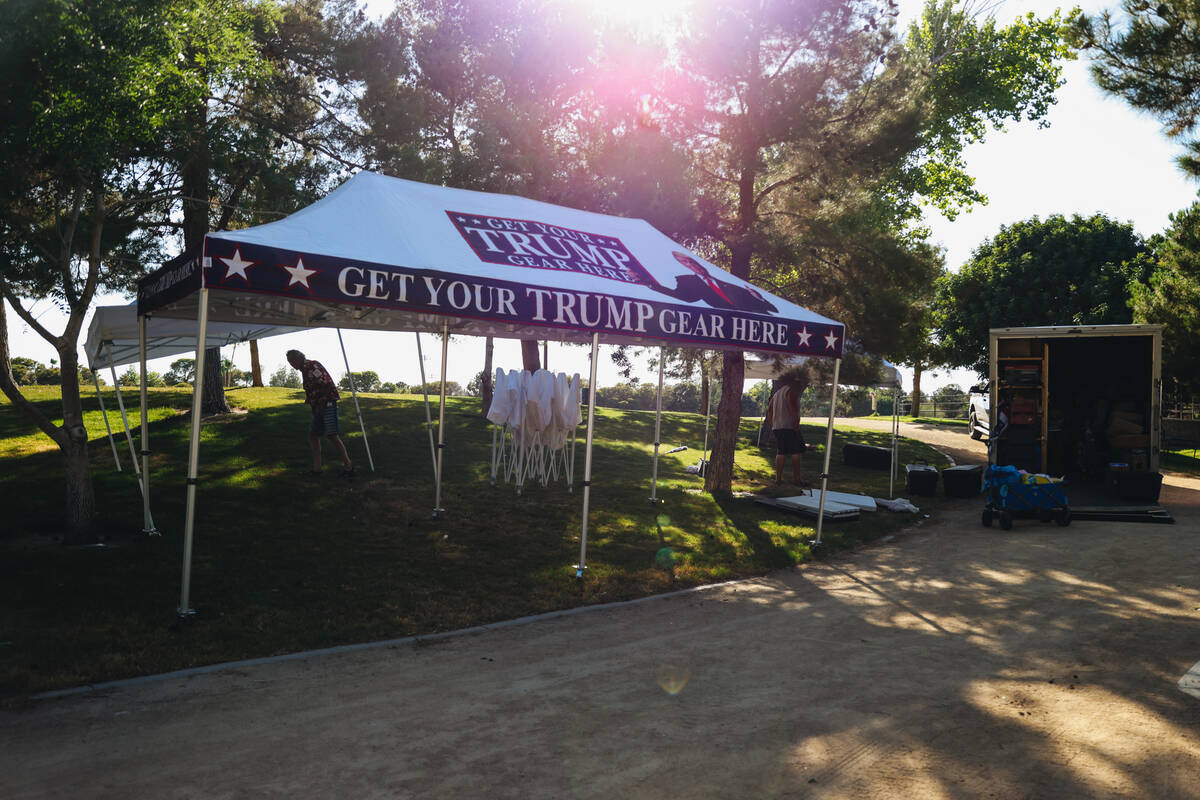 Vendors set up tents the day before former President Donald Trump’s June 9 rally in Suns ...