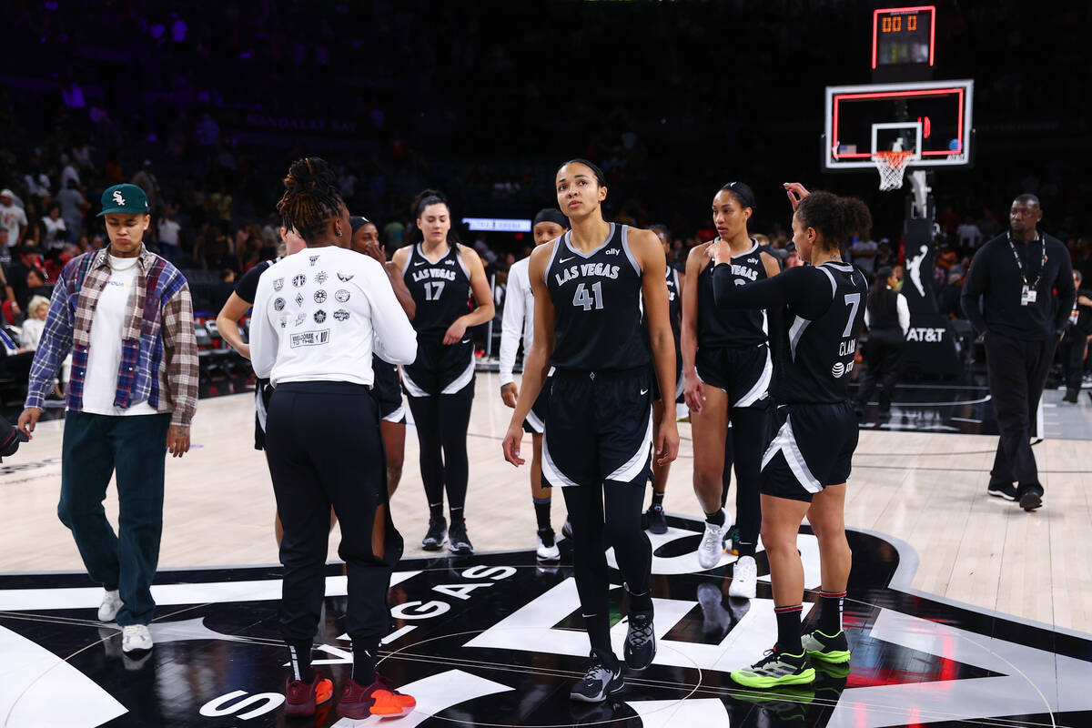The Las Vegas Aces react after losing a WNBA basketball game against the Seattle Storm at Miche ...