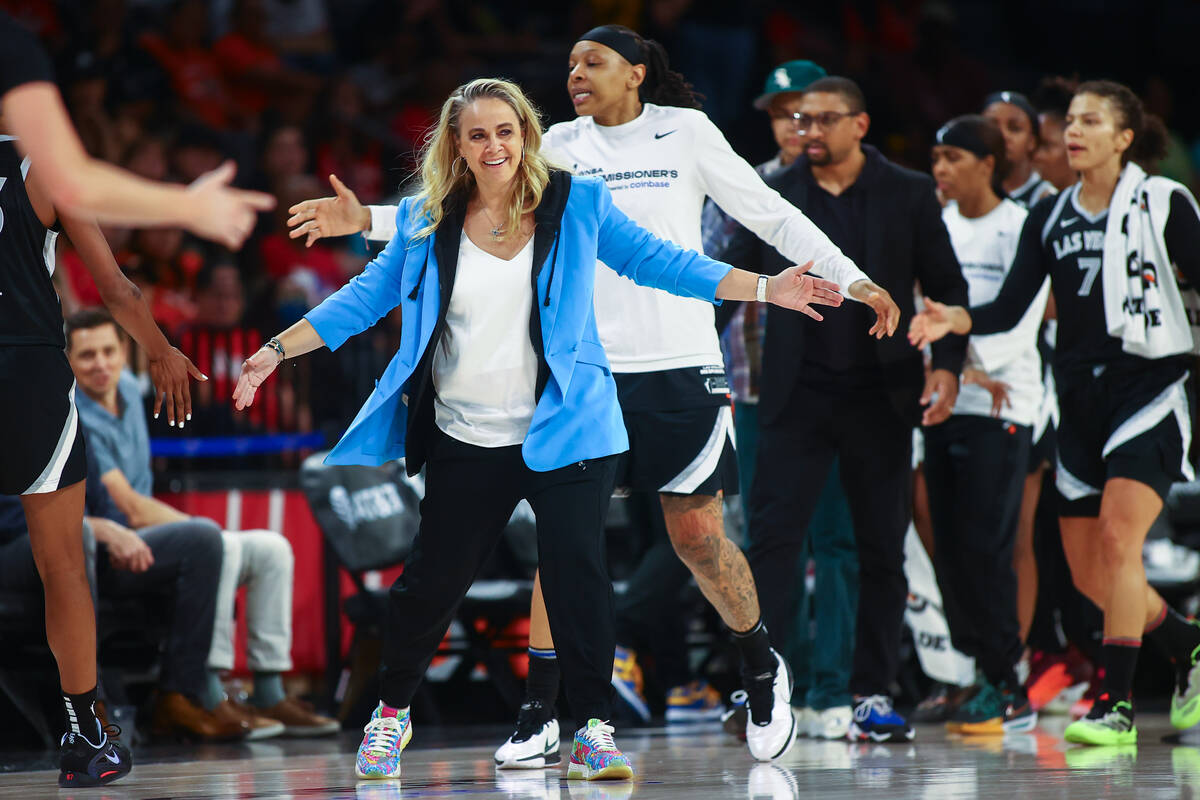 Las Vegas Aces head coach Becky Hammon welcomes her team in for a time out during the first hal ...