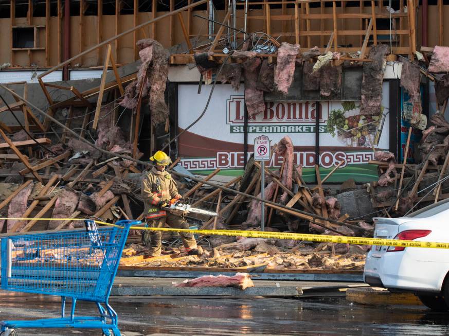 Clark County firefighters work through debris after a portion of La Bonita supermarket collapse ...