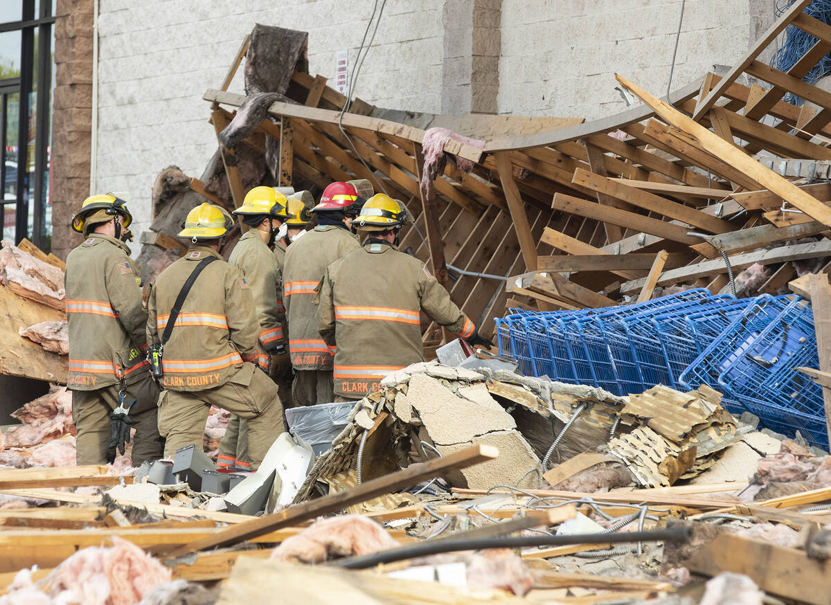 Clark County firefighters work through debris after a portion of La Bonita supermarket collapse ...