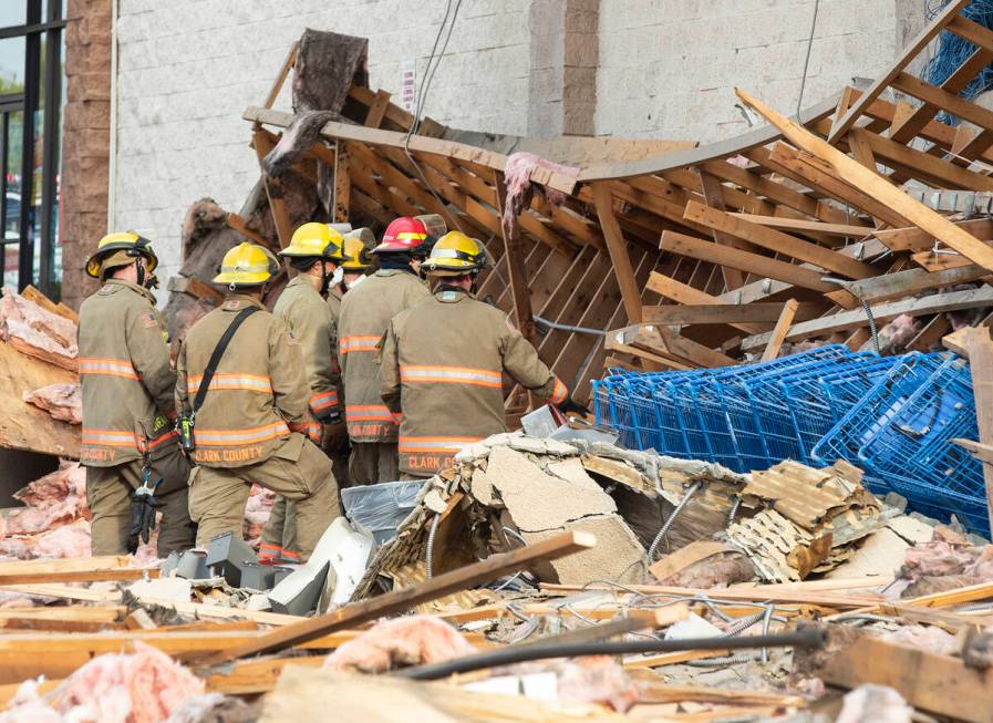 Clark County firefighters work through debris after a portion of La Bonita supermarket collapse ...