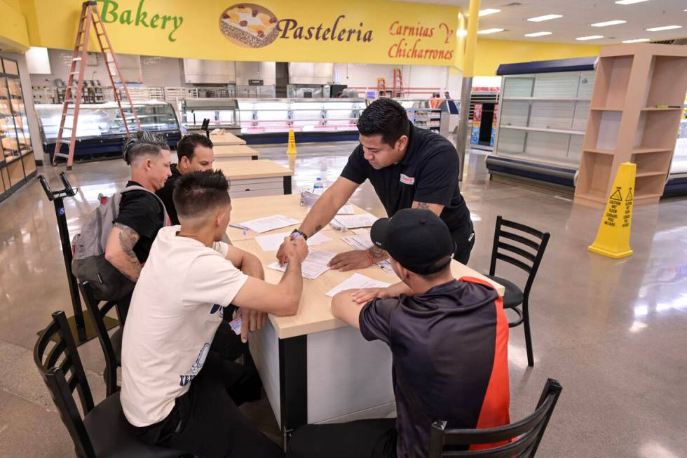 La Bonita General Manager Armando Martinez helps job applicants while preparations continue Fri ...