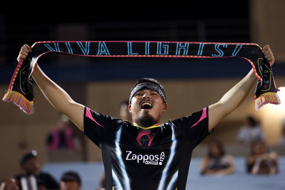A Las Vegas Lights FC fan cheers after his team scored on Miami FC during a soccer match at Cas ...