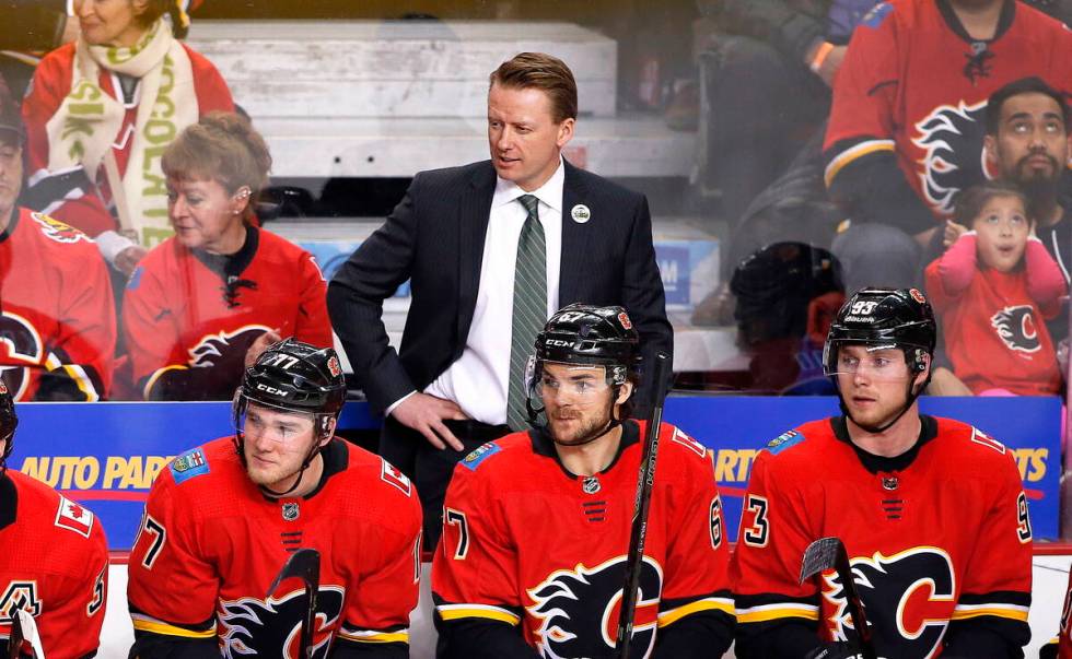 Calgary Flames coach Glen Gulutzan watches during the team's NHL hockey game against the Vegas ...