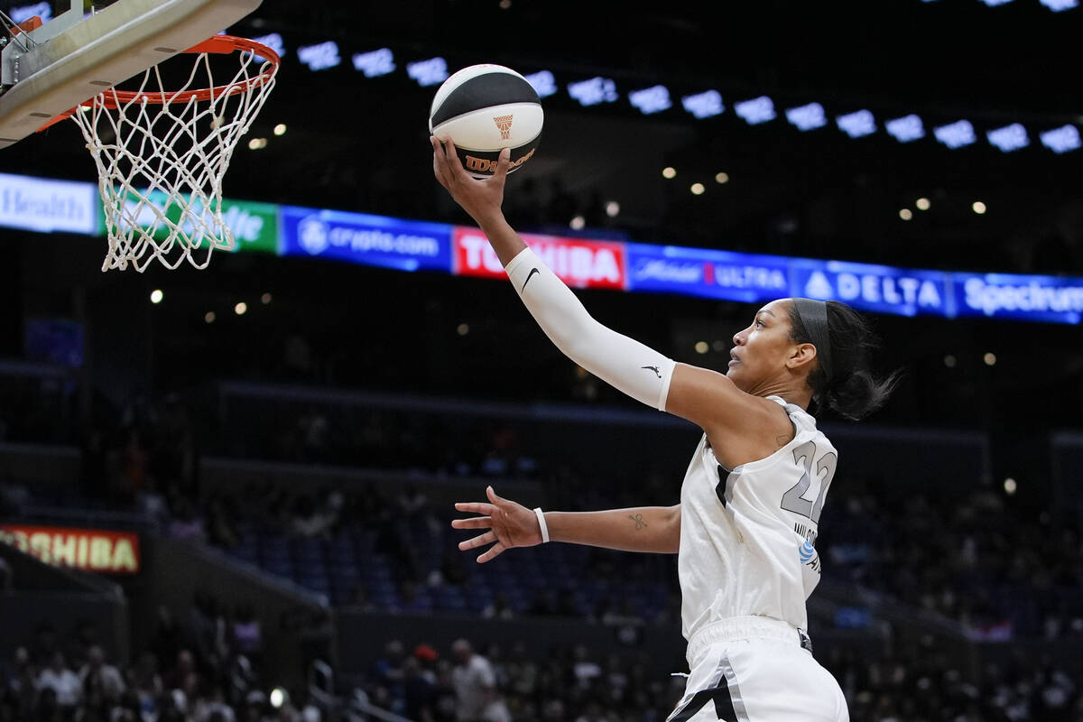 Las Vegas Aces center A'ja Wilson shoots during the first half of a WNBA basketball game agains ...