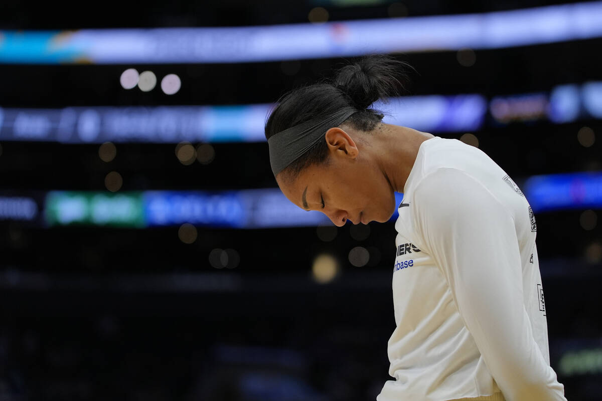 Las Vegas Aces center A'ja Wilson takes a moment before a WNBA basketball game against the Los ...