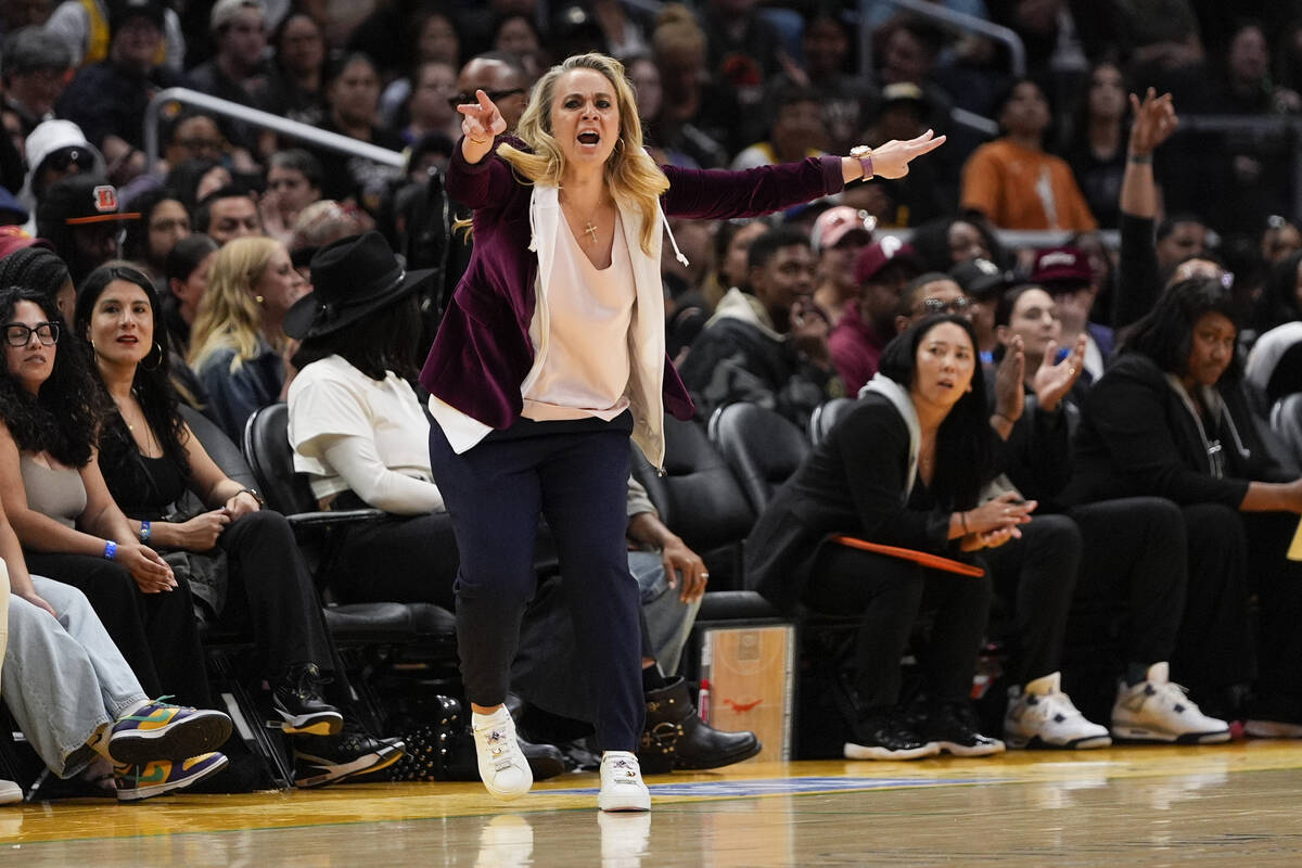 Las Vegas Aces head coach Becky Hammon gestures during the first half of a WNBA basketball game ...