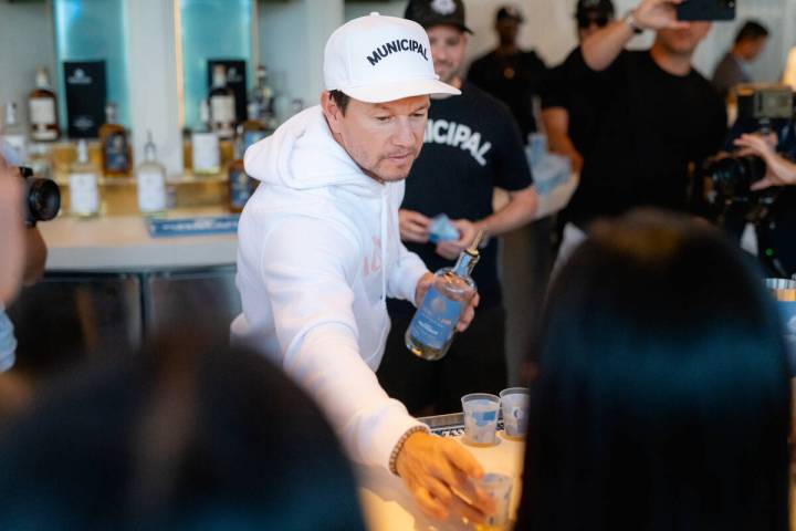 Mark Wahlberg serves his company's Flecha Azul Tequila cocktails during an unbilled appearance ...