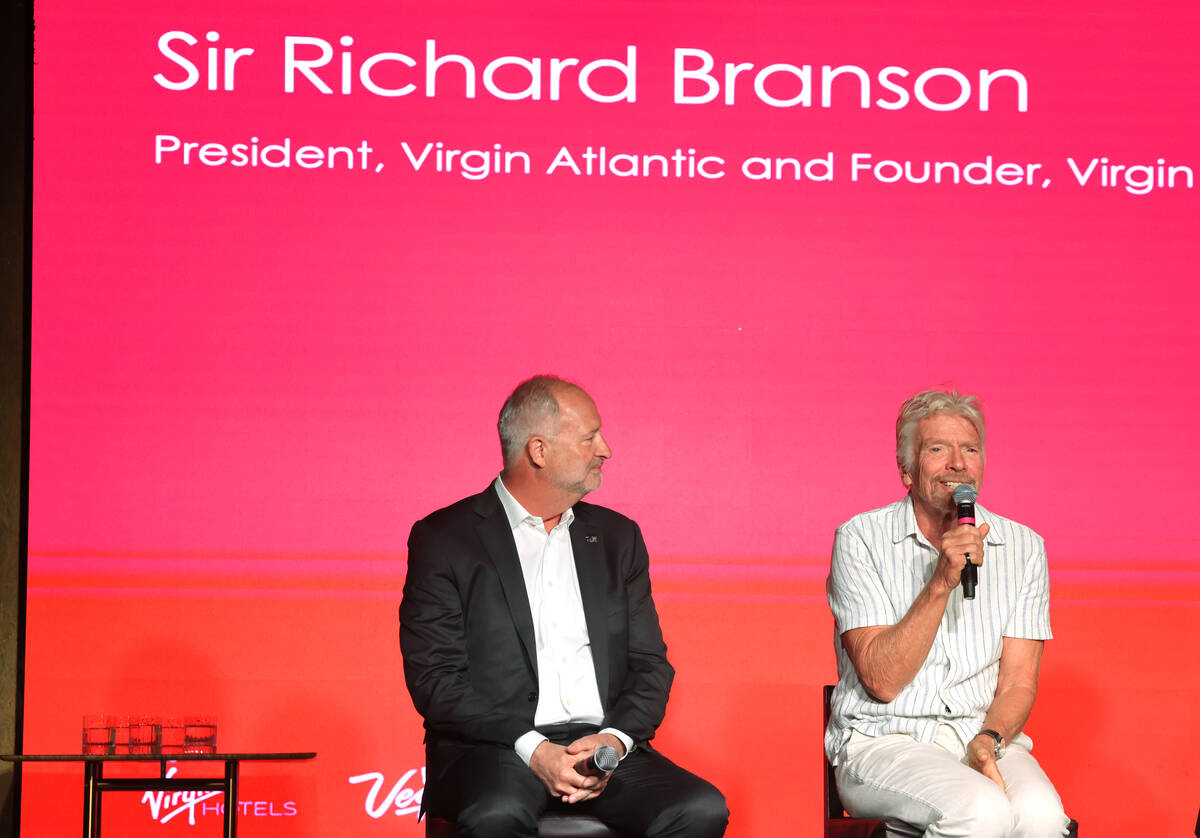 Sir Richard Branson, president and founder of Virgin Group, right, talks about the launch of V ...