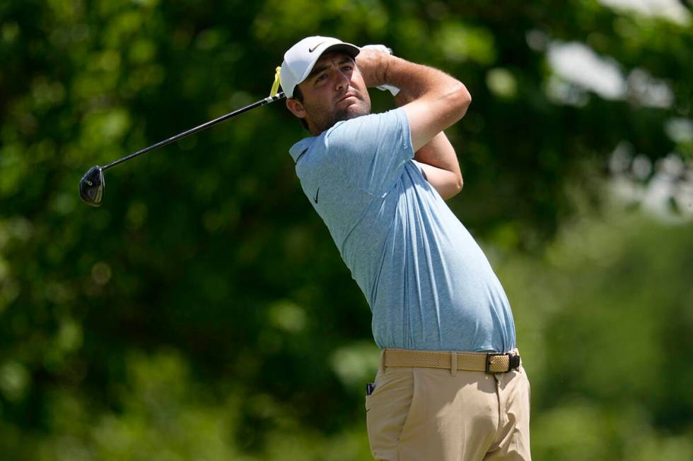 Scottie Scheffler hits from the fifth tee during the final round of the Memorial golf tournamen ...