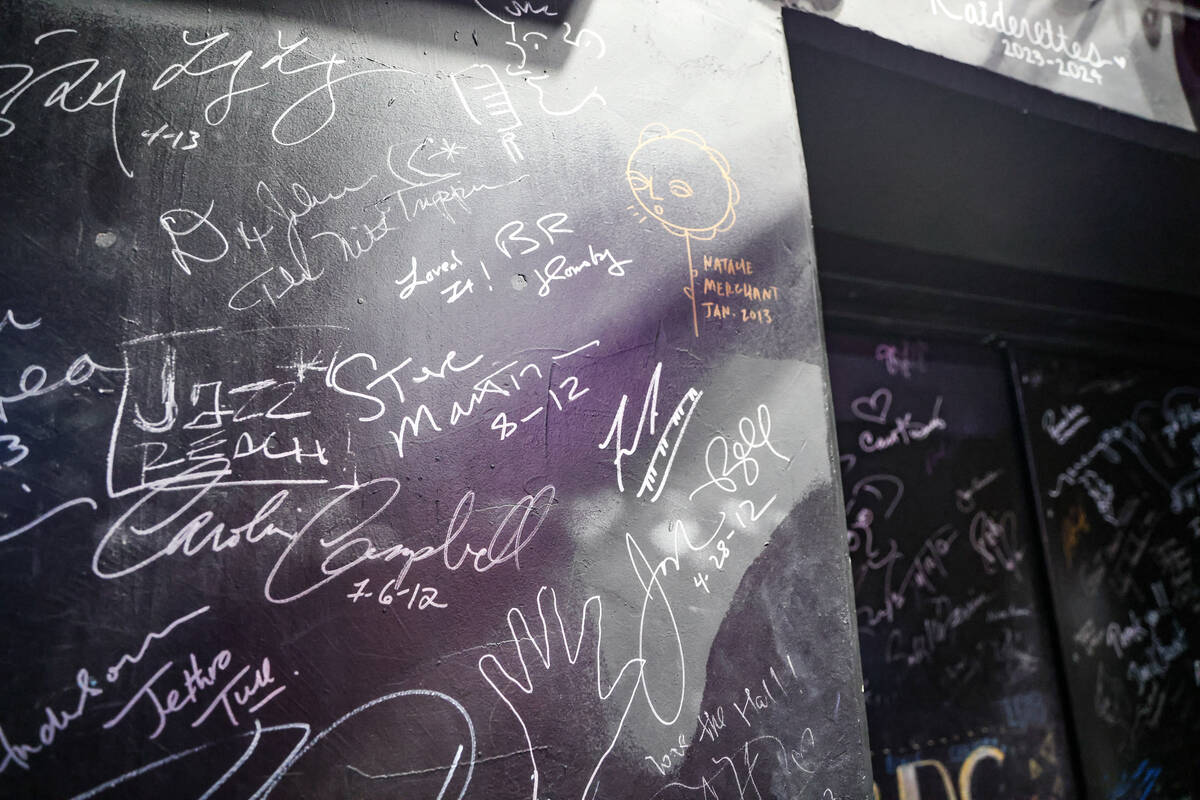 Signatures from stars, including Steve Martin’s, center, adorn the backstage walls at The Smi ...