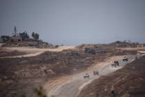 Israeli soldiers near the Israeli-Gaza border as seen from southern Israel, Monday, June 10, 20 ...
