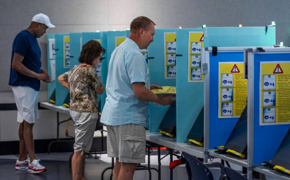 Voters cast their choices during Nevada's primary election day at the polls within the Summerli ...