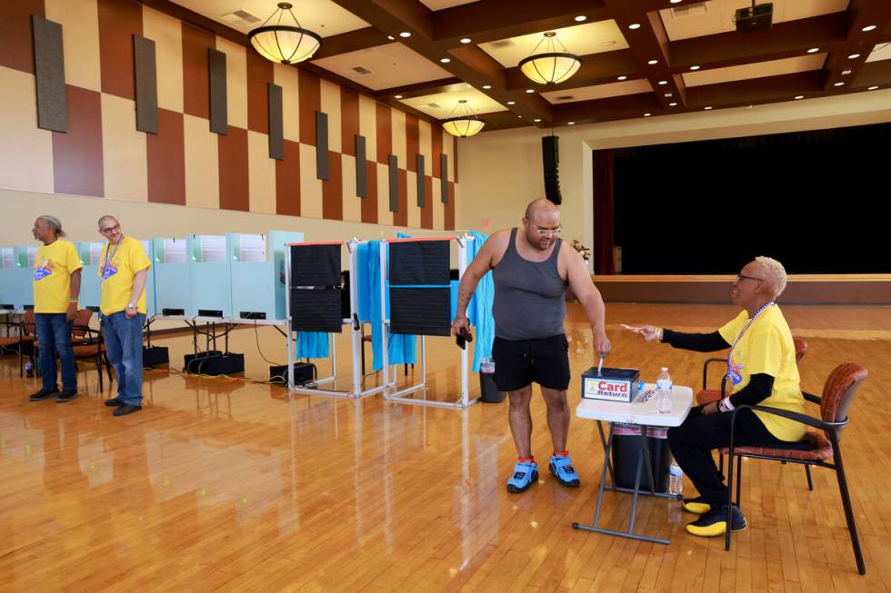 David Navarro of Las Vegas returns his card after voting at the Historic Fifth Street School in ...