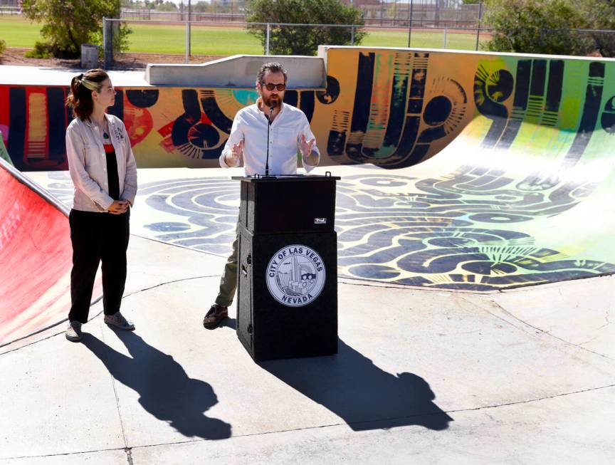 Jess Demlow, left, of Paints with Care, look on as local muralist and skateboarder Nico Roussin ...