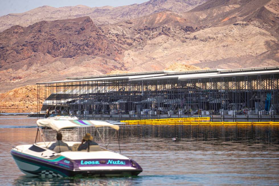 The scene where a fire at the Las Vegas Boat Harbor destroyed over a dozen boats after midnight ...